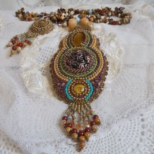 Fauve pendant necklace embroidered with several tiger eyes, Haute-Couture style